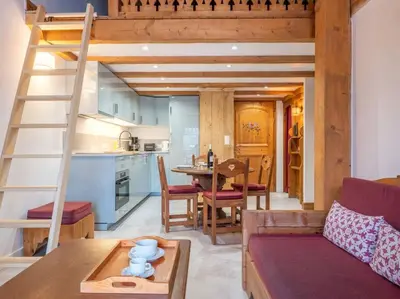 a living room with a loft bed and a kitchen at Le Cristal - Central apartment close to the slopes & Free Parking - By Cozee Rentals in Chamonix-Mont-Blanc