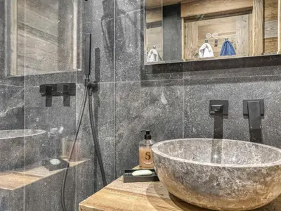 a bathroom with a bowl sink and a shower at Appartement rénové 2 pièces, balcon, parking à Megève - FR-1-453-319 in Megève