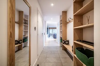 a hallway of a house with wooden shelves at Maira Les Carroz - by EMERALD STAY in Arâches-la-Frasse