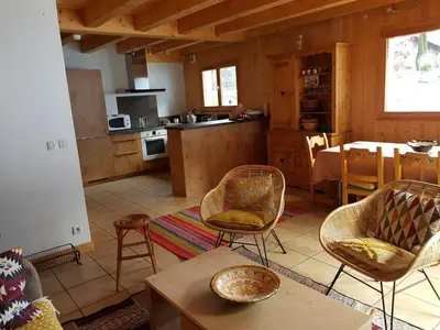 a kitchen with a table and chairs in a room at Chalet la Cry à St Gervais in Saint-Gervais-les-Bains