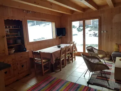 a dining room with a table and chairs at Chalet la Cry à St Gervais in Saint-Gervais-les-Bains