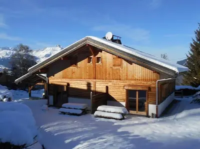 a log cabin in the snow with snow at Chalet la Cry à St Gervais in Saint-Gervais-les-Bains