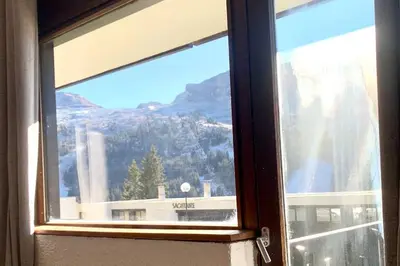 a window with a view of a mountain at Studio Flaine à coté des pistes in Arâches-la-Frasse