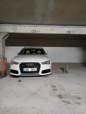 a white car parked under a parking garage at Ski1600 - GrandMassif in Samoëns