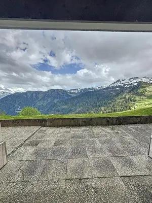 a view of a mountain range from a patio at Ski1600 - GrandMassif in Samoëns
