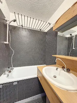 a bathroom with a sink and a bath tub at Ski1600 - GrandMassif in Samoëns