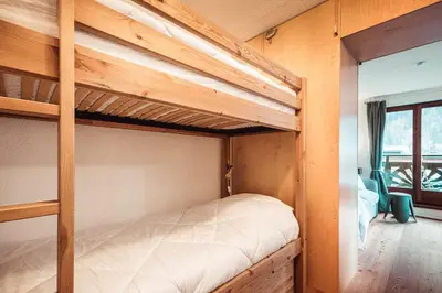 a bedroom with two bunk beds in a house at Vertice - Center Chamonix Mont-Blanc View in Chamonix-Mont-Blanc