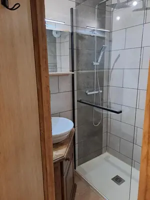 a bathroom with a shower and a sink at Appartement équipé centre Carroz et garage in Arâches-la-Frasse