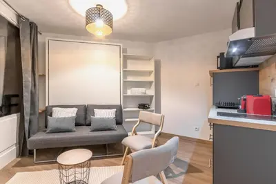 a living room with a couch and two chairs at Lachenal - Centre - Navette de ski - Balcon in Chamonix-Mont-Blanc
