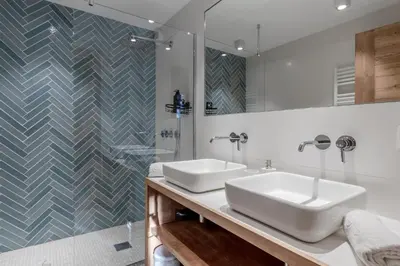 a bathroom with two sinks and a shower at La Ferme du Mont in Servoz