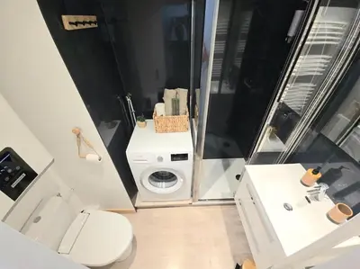a small bathroom with a toilet and a sink at Studio avec balcon vue MontBlanc et parking gratuit le nid daigle in Chamonix-Mont-Blanc