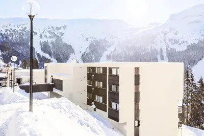 an office building with a mountain in the background at Résidence Sirius - maeva Home - Studio 4 personnes - Confort MAE-3731 in Arâches-la-Frasse