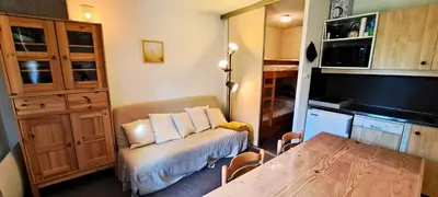 a kitchen with a wooden table and a dining room at Résidence Sirius - maeva Home - Studio 4 personnes - Confort MAE-3731 in Arâches-la-Frasse