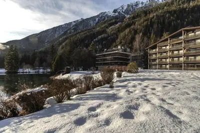 a snow covered path in front of a lodge at Cristal des Glaces - Balcon avec vue imprenable in Chamonix-Mont-Blanc