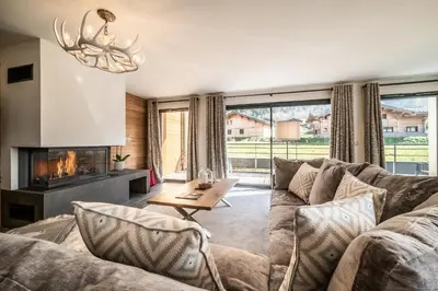 a living room with a couch and a fireplace at Chalet Ikigai Chamonix - by EMERALD STAY in Chamonix-Mont-Blanc