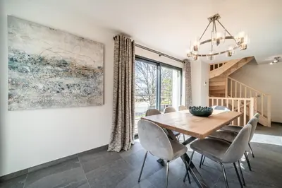 a dining room with a table and chairs at Chalet Ikigai Chamonix - by EMERALD STAY in Chamonix-Mont-Blanc