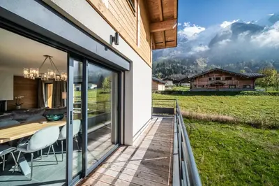 a house with a balcony with a view of the mountains at Chalet Ikigai Chamonix - by EMERALD STAY in Chamonix-Mont-Blanc