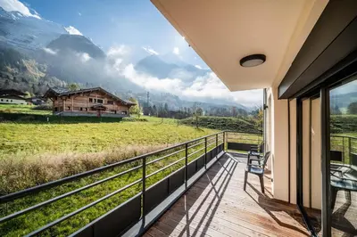 a balcony with a view of a house at Chalet Ikigai Chamonix - by EMERALD STAY in Chamonix-Mont-Blanc