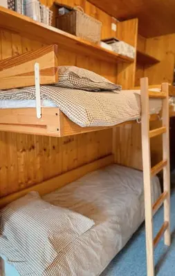 a couple of bunk beds in a room at Blanches Alpes Appartement Megève in Megève
