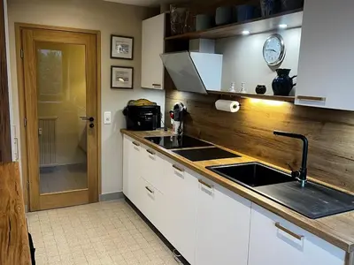 a kitchen with a sink and a counter top at Vue du Mont-Blanc in Passy
