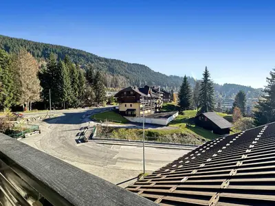 a view of a train station with a building in the background at ob219 4 pieces duplex 6 personnes proche pistes in Les Carroz d'Araches