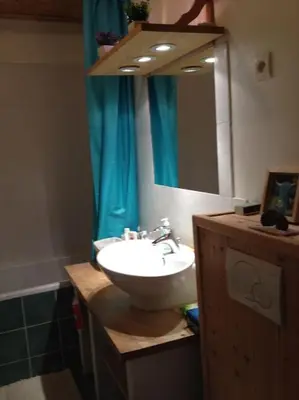 a bathroom with a sink and a mirror at Appart cosy et lumineux au cœur de Saint Gervais in Saint-Gervais-les-Bains