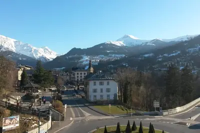 a view of a town with mountains in the background at Appart cosy et lumineux au cœur de Saint Gervais in Saint-Gervais-les-Bains