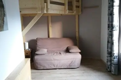 a room with a bunk bed with a bean bag chair at Appart cosy et lumineux au cœur de Saint Gervais in Saint-Gervais-les-Bains