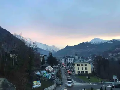 a view of a city with mountains in the background at Appart cosy et lumineux au cœur de Saint Gervais in Saint-Gervais-les-Bains