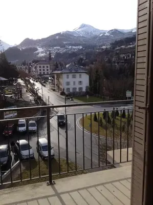 a balcony with a view of a street with cars at Appart cosy et lumineux au cœur de Saint Gervais in Saint-Gervais-les-Bains