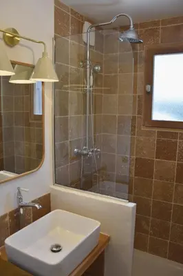 a bathroom with a sink and a shower at Chez Colette - Appartement à la montagne in Demi-Quartier