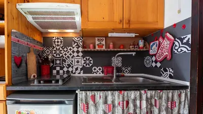 a kitchen with a sink and a stove at Grand Morillon 212 - 2P5 in Morillon
