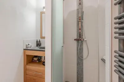 a bathroom with a shower and a sink at La Cremaillere in Sallanches