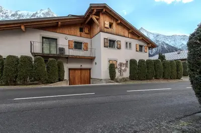 a house on the side of a road at Jardin du Brevent in Chamonix-Mont-Blanc