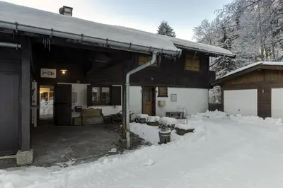a house with snow on the ground in front of it at Le Bedux - Privée - Calme - Terrasse - Vues in Chamonix-Mont-Blanc