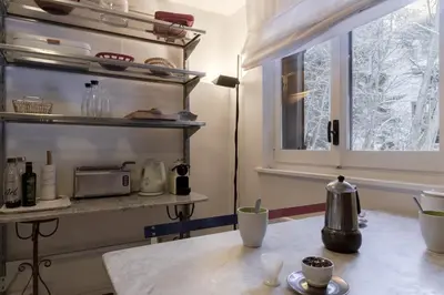 a kitchen with a table and a window at Le Bedux - Privée - Calme - Terrasse - Vues in Chamonix-Mont-Blanc