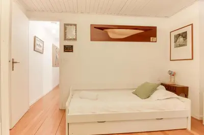 a bedroom with a white bed in a room at Le Bedux - Privée - Calme - Terrasse - Vues in Chamonix-Mont-Blanc