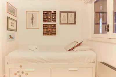 a white room with a bed and a window at Le Bedux - Privée - Calme - Terrasse - Vues in Chamonix-Mont-Blanc