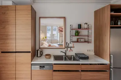 a kitchen with a sink and a mirror at Le Metropole - Centre-ville - Spacieux in Chamonix-Mont-Blanc