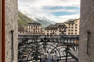 a view from a balcony of a city with mountains at Le Metropole - Centre-ville - Spacieux in Chamonix-Mont-Blanc