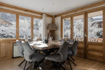 a dining room with a table and chairs at Chalet Des Grands Vanays in Les Houches