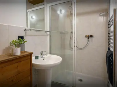 a bathroom with a shower and a sink and a shower at Chalet Les Pellys - OVO Network in Samoëns