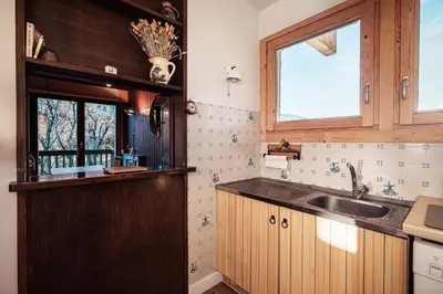 a kitchen with a sink and a window at Appartement Cornec - Your stay in Megève in Megève