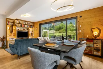 a dining room with a table and chairs at La Yaute Chamonix-Les Houches in Les Houches