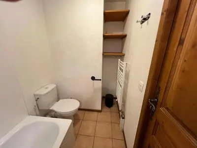 a small bathroom with a toilet and a sink at Chamonix Charmant duplex 4 personnes et un enfant in Chamonix-Mont-Blanc