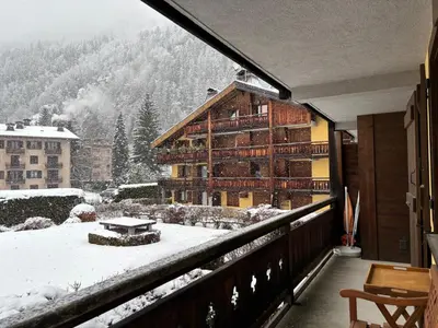 a balcony of a lodge with snow on the ground at Capucins 3 in Chamonix-Mont-Blanc