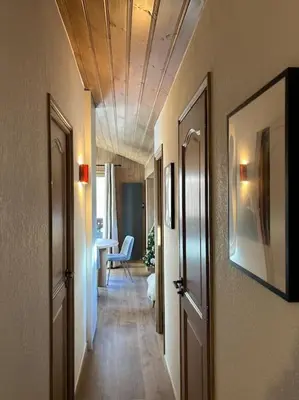 a hallway with a hallway leading to a room at Appartement avec vue sur les Dômes du Miage in Les Contamines-Montjoie