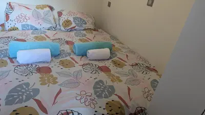 a bed with two pillows on top of it at Central Mont Blanc View Apartment, balcony, free parking in Chamonix-Mont-Blanc