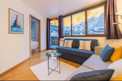 a living room with a couch and a table at Escape in Chamonix breathtaking view Mont-Blanc in Chamonix-Mont-Blanc