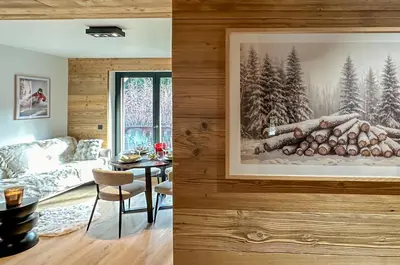 a living room with a couch and a table with logs at Stella Megeve Palais garage in Megève